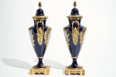 A pair of bronze-mounted Sevres style porcelain vases and covers, 19/20th C.