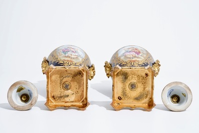 A pair of bronze-mounted Sevres style porcelain vases and covers, 19/20th C.