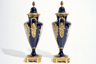 A pair of bronze-mounted Sevres style porcelain vases and covers, 19/20th C.