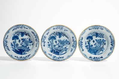 Seven Dutch Delft blue and white plates and a large armorial dish, 17/18th C.