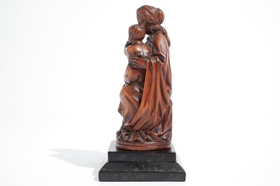 A carved boxwood Madonna with child, 17th C.