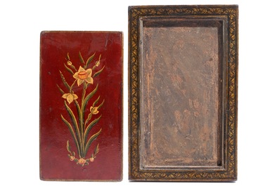 Two painted papier mache mirror frames and a painted panel, Qajar, Iran, 19th C.