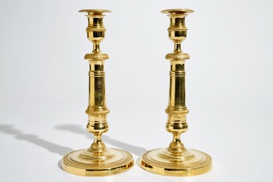 A pair of gilt bronze Empire candlesticks, France, 19th C.