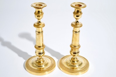 A pair of gilt bronze Empire candlesticks, France, 19th C.