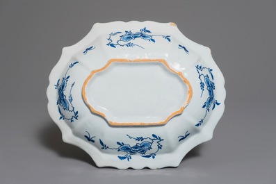 A Dutch Delft blue and white salad bowl with lotus scrolls, 18th C.