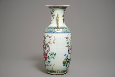 A large Chinese famille rose vase with peacocks and antiquities, 19th C.