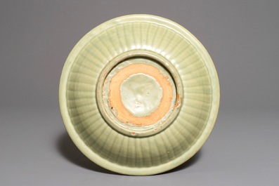 A Chinese Longquan celadon charger with underglaze dragon, Ming