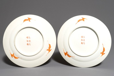 A pair of Chinese famille rose yellow-ground plates, Guangxu mark, 19/20th C.