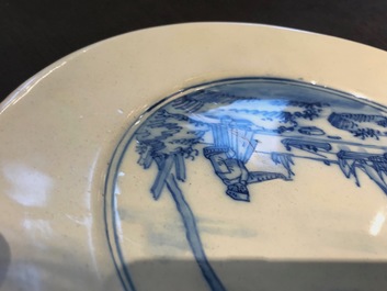 A Dutch Delft blue and white armorial dish dated 1683 and a blue and white landscape plate, 17th C.