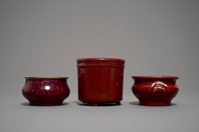 Two Chinese oxblood-glazed incense burners and a brush pot, 19/20th C.