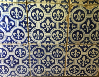 A field of 24 Dutch Delft blue and white tiles with Fleur de Lys, 17th C.