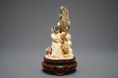 A Chinese carved ivory group of two ladies on inlaid wooden base, 1st half 20th C.