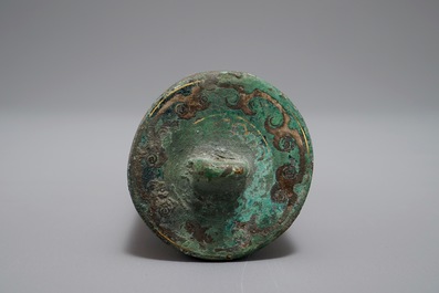 A Chinese gilt and silvered bronze seal or scroll weight, Han or later