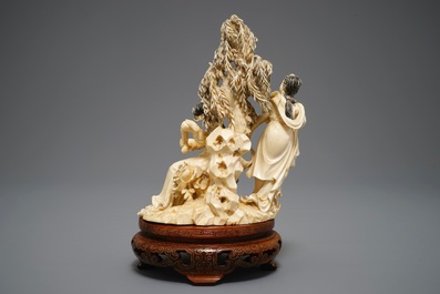 A Chinese carved ivory group of two ladies on inlaid wooden base, 1st half 20th C.