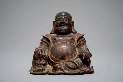 A Chinese lacquered and gilt bronze figure of Buddha, Ming