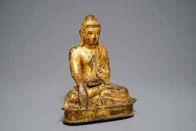 A large Burmese inlaid, gilt and lacquered bronze Mandalay-style Buddha, 19th C.