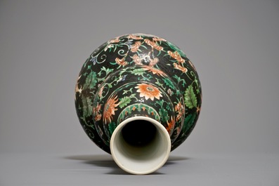 A Chinese black-ground famille verte double gourd dragon vase, 19th C.