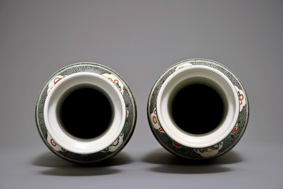 A pair of Chinese famille verte rouleau vases, Qianlong mark, 19th C.