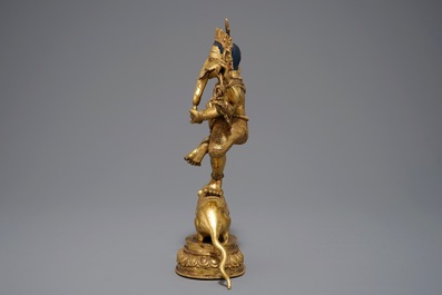 A Sino-Tibetan gilt bronze figure of Ganesha, 19/20th C.