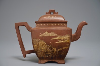A Chinese Yixing teapot and cover with applied design, 20th C.