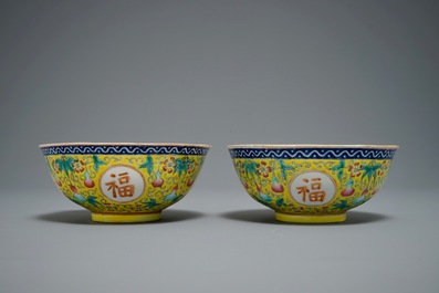 A pair of Chinese famille rose yellow-ground bowls, Guangxu mark, 19/20th C.