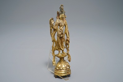 A Chinese gilt bronze figure of Guanyin, Tang or later