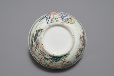 A Chinese famille rose cup and saucer depicting Lie Ti Guai with three goats, Yongzheng