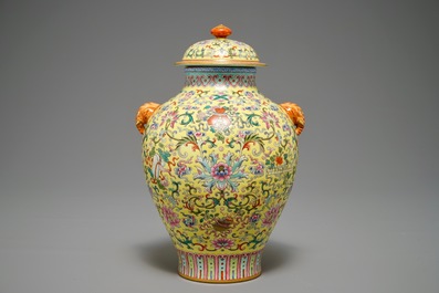 A Chinese famille rose yellow-ground vase and cover, Qianlong mark, 20th C.