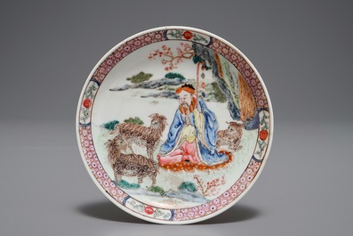 A Chinese famille rose cup and saucer depicting Lie Ti Guai with three goats, Yongzheng