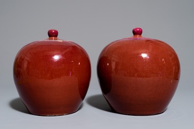 A pair of Chinese monochrome oxblood-glazed ginger jars and covers, 19th C.