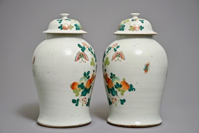 A pair of Chinese famille rose covered vases with boys among pumpkin vines, 19th C.