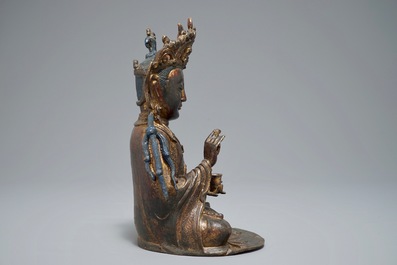 A Chinese lacquered and gilt bronze figure of Guanyin, Ming