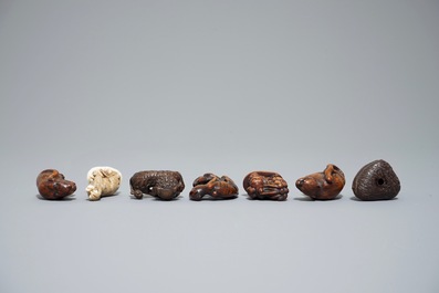 Seven Japanese carved wood and ivory netsuke and okimono, Japan, Meiji, 19/20th C.