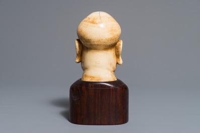 A Chinese carved ivory Luohan head on wooden bust, 1st half 20th C.