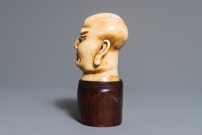 A Chinese carved ivory Luohan head on wooden bust, 1st half 20th C.