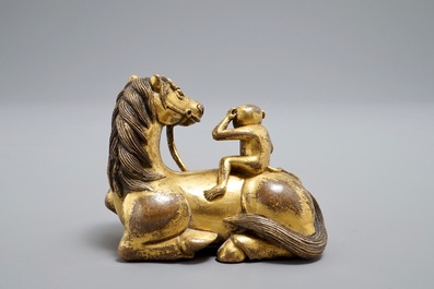 An inscribed Chinese gilt bronze model of a monkey on a horse, 19/20th C.