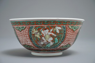 A Chinese wucai bowl with boys holding lotus flowers, Transitional period