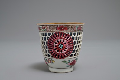 A reticulated double-walled Chinese famille rose cup and saucer, Yongzheng