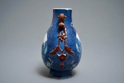 A Chinese blue and white powder blue-ground hu vase with landscape medallions, 19/20th C.