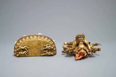 A Sino-Tibetan gilt bronze figure of Mahakala and his consort Yab-Yum, 19/20th C.