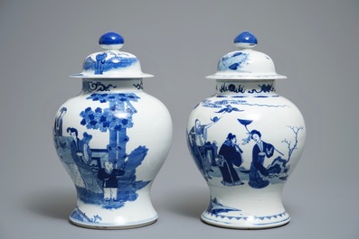 Two Chinese blue and white vases and covers with figures, 19th C.