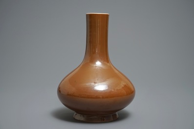 A Chinese cafe-au-lait glazed bottle vase, Qianlong mark, 19th C.