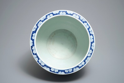 A Chinese blue and white fish bowl with a river landscape, 19th C.