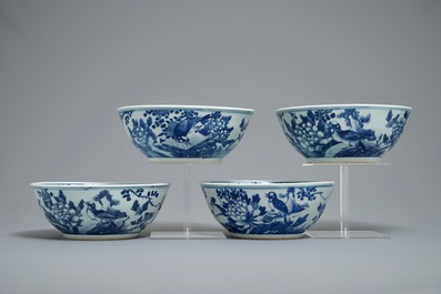 Four Chinese blue and white bowls with birds, butterflies and flowers, 19th C.