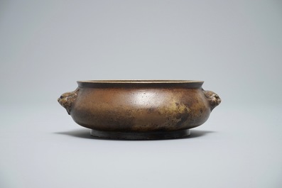 A Chinese bronze censer on wooden stand, Xuande mark, 18th C.