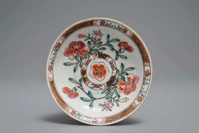 A reticulated double-walled Chinese famille rose cup and saucer, Yongzheng