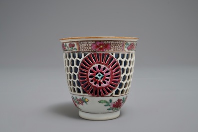 A reticulated double-walled Chinese famille rose cup and saucer, Yongzheng