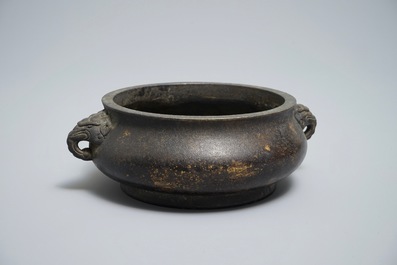 A Chinese bronze incense burner with elephant head handles, qianqing gongbao mark, Ming