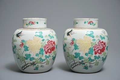 A pair of Chinese famille rose jars and covers with insects and flowers, Qianlong mark, 19/20th C.