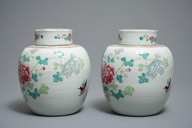 A pair of Chinese famille rose jars and covers with insects and flowers, Qianlong mark, 19/20th C.